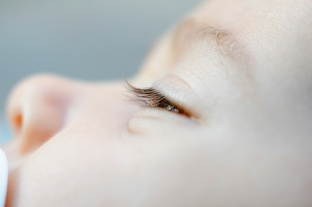Close-up portrait of newborn baby girl. 