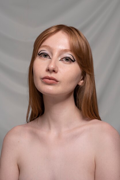 Close up portrait of person wearing make up liner