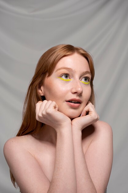 Close up portrait of person wearing make up liner