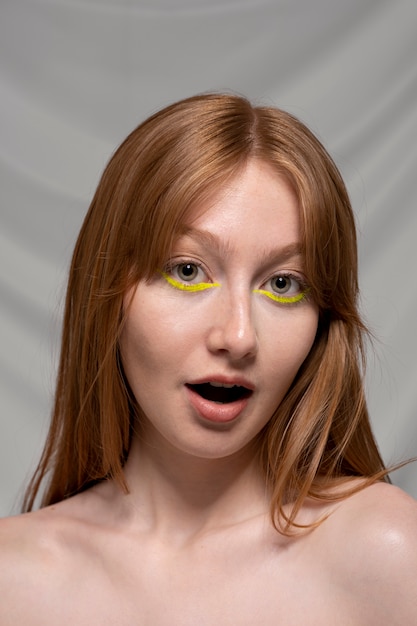 Close up portrait of person wearing make up liner