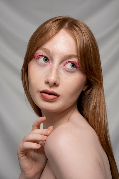 Close up portrait of person wearing make up liner