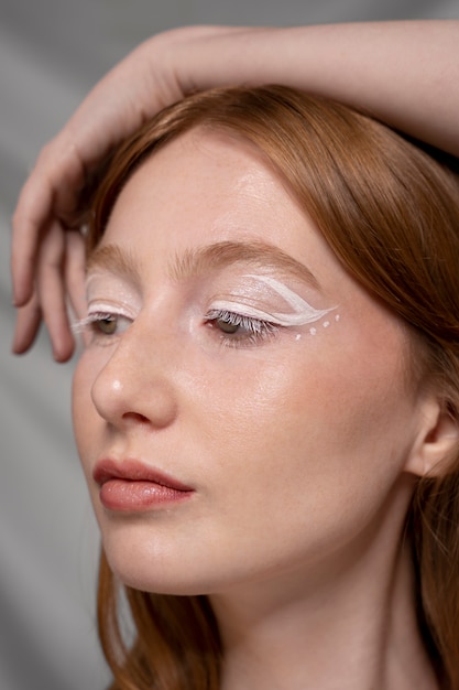 Close up portrait of person wearing make up liner