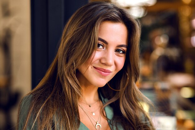 Close up portrait of portrait magnificent young sensual model with long brown hairs and shy cute smile, natural pure beauty, soft make up .