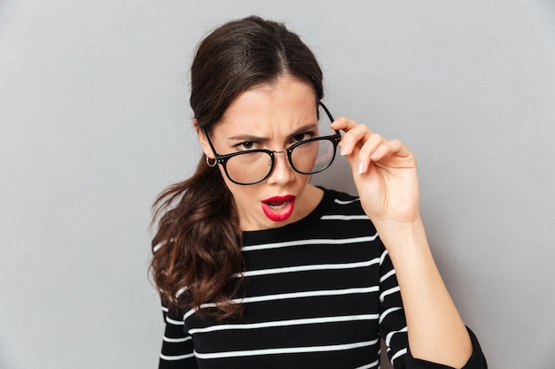 Close up portrait of a serious woman in eyeglasses