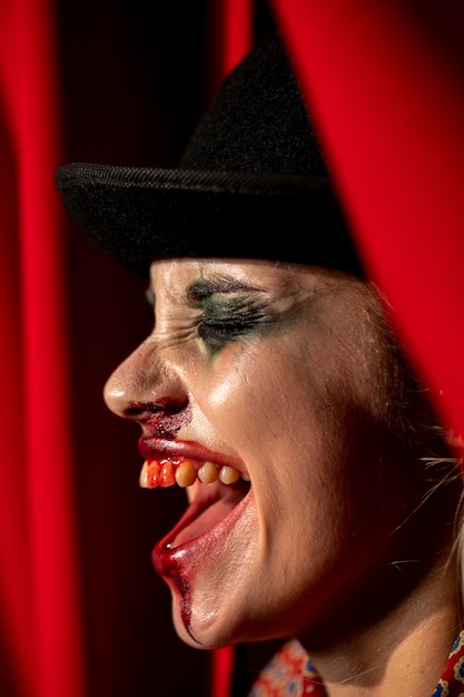 Close-up portrait of sideways halloween clown make-up