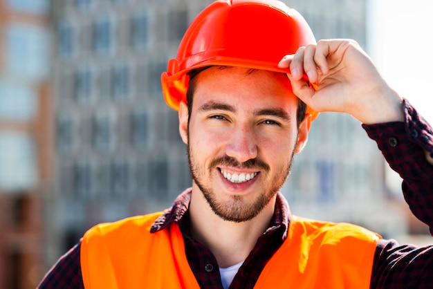 Close-up portrait of smiling construction engineer