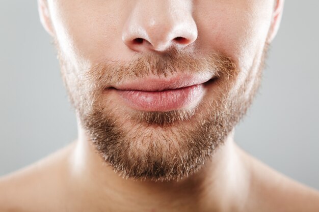 Close up portrait of smiling half men's face