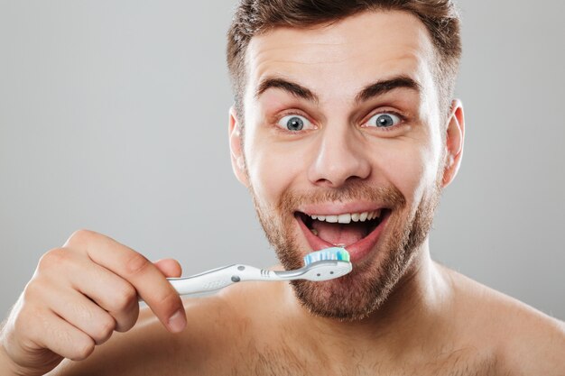 Close up portrait of a smiling half naked man