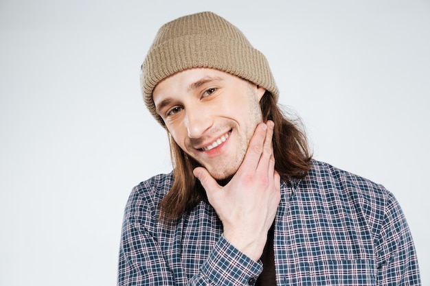 Close up portrait of Smiling hipster holding chin