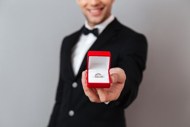 Close up portrait of a smiling man dressed in tuxedo