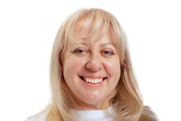 Close-up portrait of smiling woman posing isolated over white background