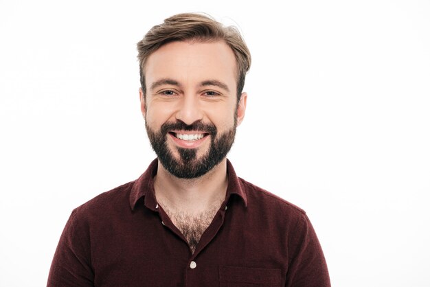 Close up portrait of a smiling young bearded man