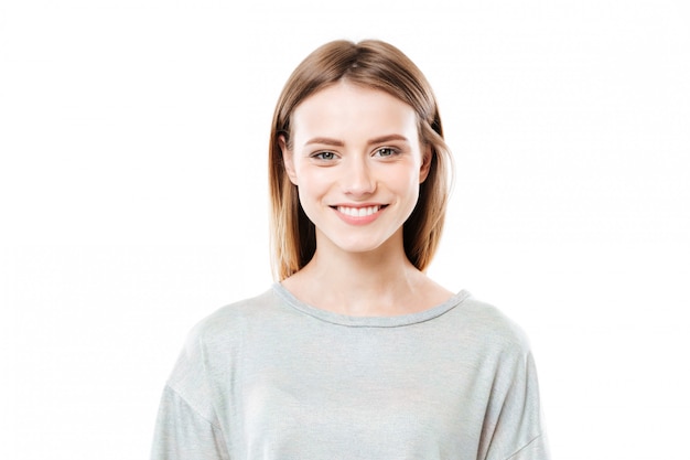 Close up portrait of a smiling young woman looking at camera