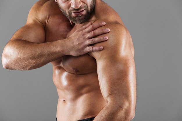 Close up portrait of a strong muscular male bodybuilder
