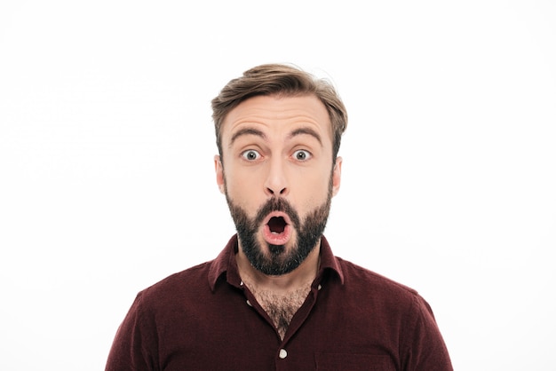 Close up portrait of a surprised young bearded man