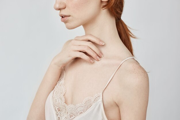 Close up portrait of tender young redhead girl.