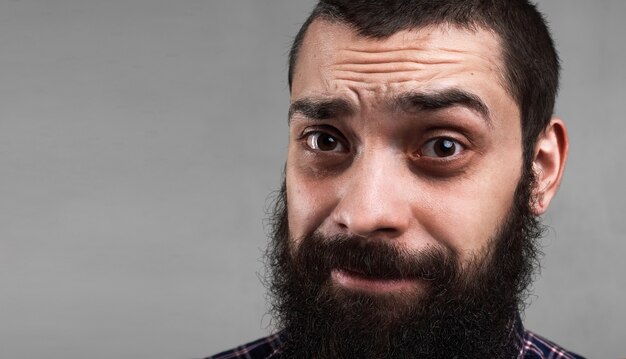 Close up portrait of tired bearded man. Morning face. Need coffee to get up early. Sick person. Problems concept.