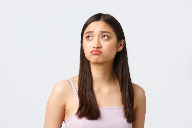 Close-up portrait of upset gloomy beautiful asian girl p