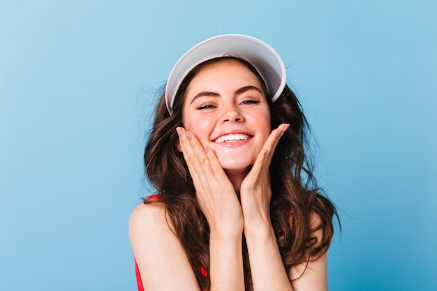 Close-up portrait of woman in sports cap