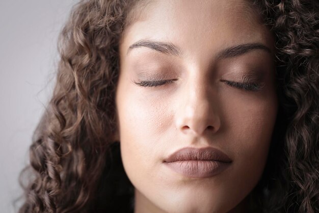 close-up portrait of woman with closed eyes