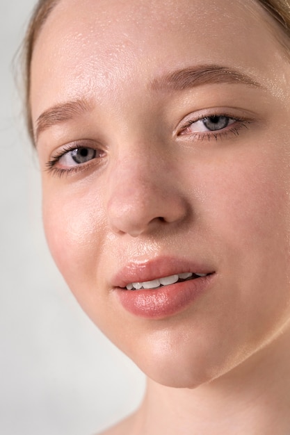 Close up portrait of woman with hydrated skin