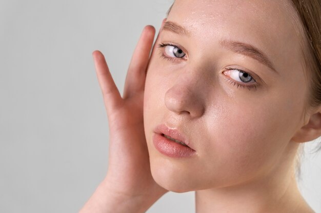 Close up portrait of woman with hydrated skin