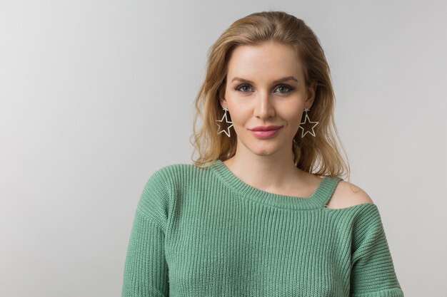 Close-up portrait of young attractive confident sexy woman, casual style, stylish earrings, green sweater, independent, isolated, looking in camera, looking in camera, natural make-up