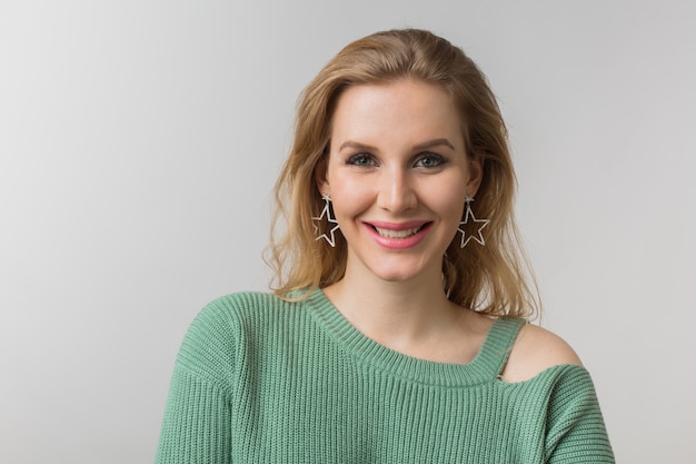 Close-up portrait of young attractive confident sexy woman, casual style, stylish earrings, green sweater, independent, isolated, looking in camera, looking in camera, natural make-up