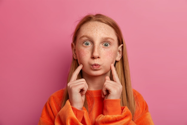 Close up portrait of young beautiful girl isolated