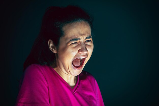 Close up portrait of young crazy scared and shocked woman   