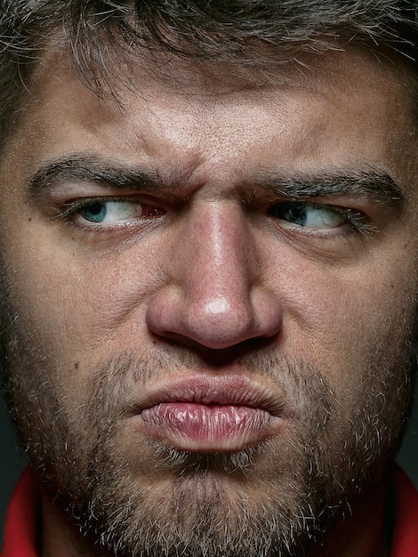 Free photo close up portrait of young and emotional caucasian man. highly detail photoshoot of male model with well-kept skin and bright facial expression. concept of human emotions.