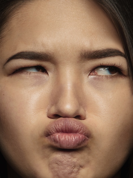 Close up portrait of young and emotional chinese woman.