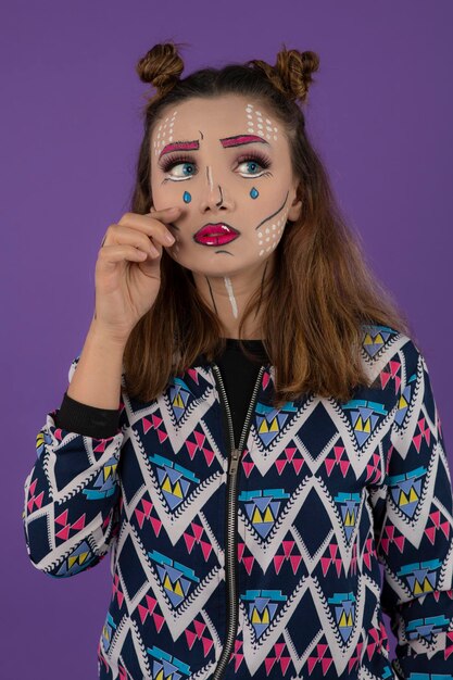 Close-up portrait of young girl with sad make up . High quality photo