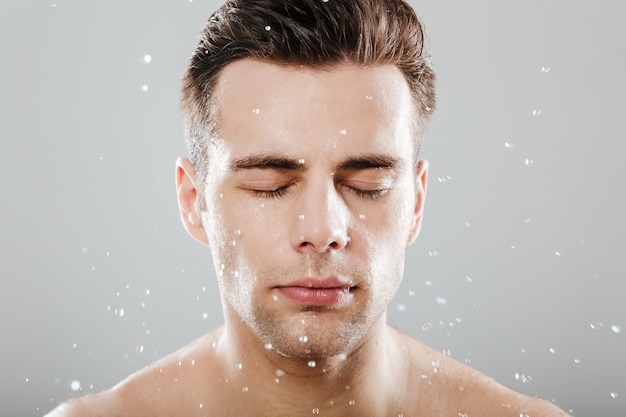 Close up portrait of a young half naked man