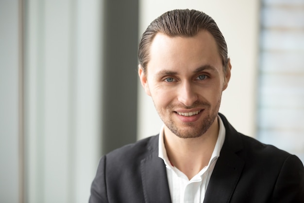 Close up portrait of young handsome successful man