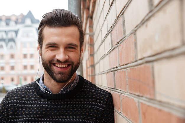 Close up portrait of a young laughing man