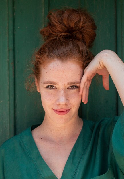 Close-up portrait of young redhead woman