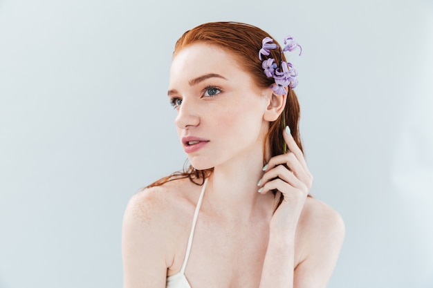 Close up portrait of a young sensual ginger woman posing