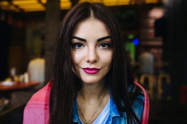 Close-up portrait of young woman face with clean fresh skin - close-up