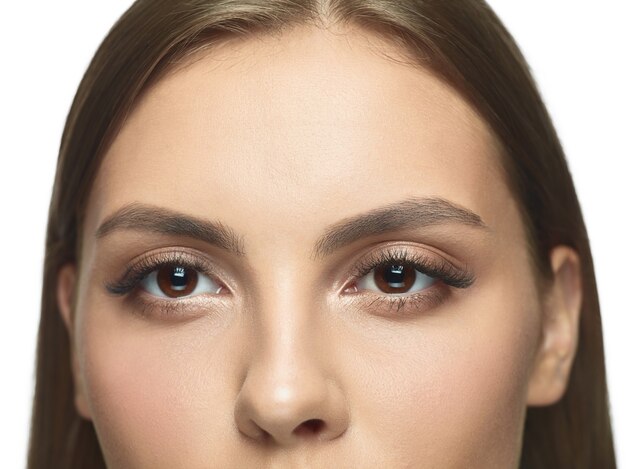 Close-up portrait of young woman's eyes with no wrinkles.