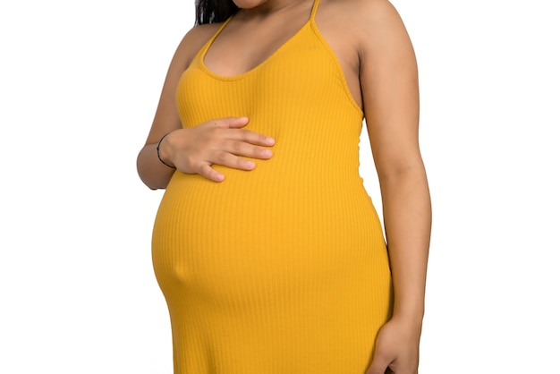 Close-up of pregnant woman touching her big belly