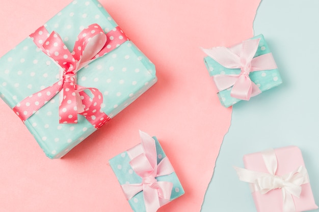 Close-up of presents in different sizes placed on dual background