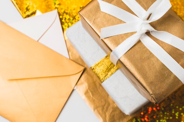 Close-up of presents with envelopes