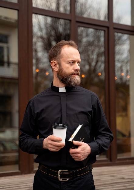 Close up on priest in his lunch time