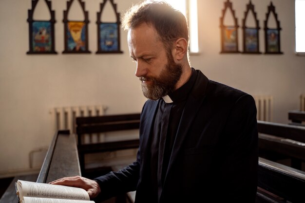 Close up on priest praying