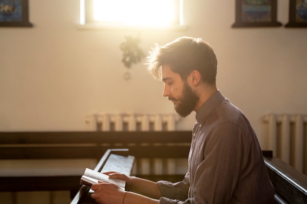 Close up on priest reading form the bible