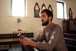 Free photo close up on priest reading form the bible