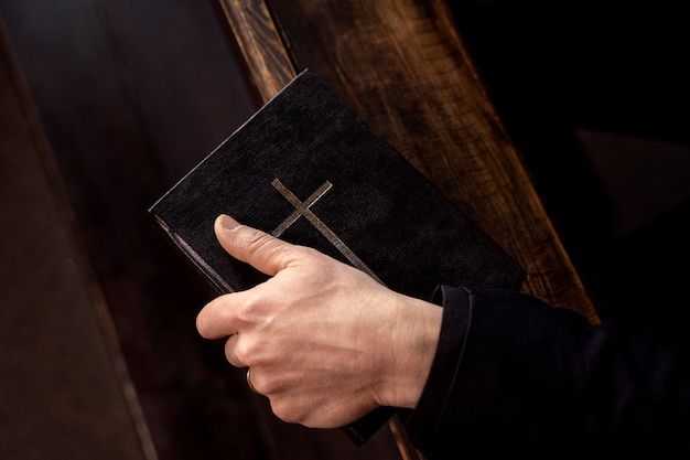 Close up on priest reading form the bible