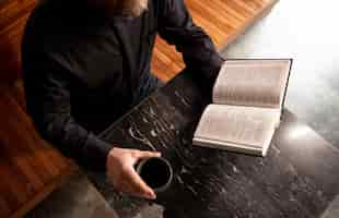 Free photo close up on priest reading form the bible