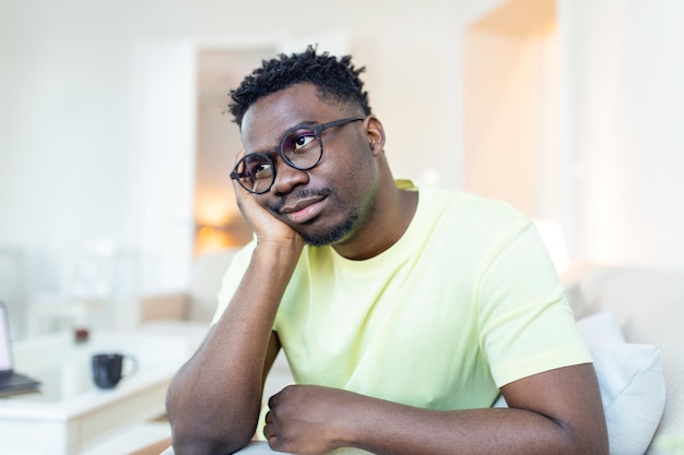 Free photo close up profile view of pensive upset african american man look in distance thinking of personal problems thoughtful sad biracial male feel depressed lost in thoughts pondering having dilemma